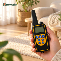 Hand holding the training collar remote with static, vibration and sound buttons